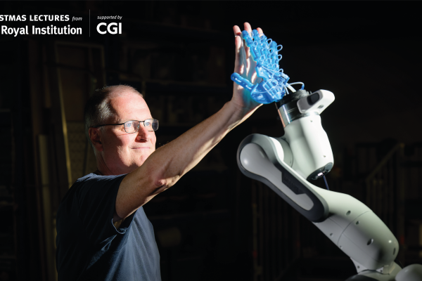 Decorative image of Professor Mike Wooldridge touching a robot hand