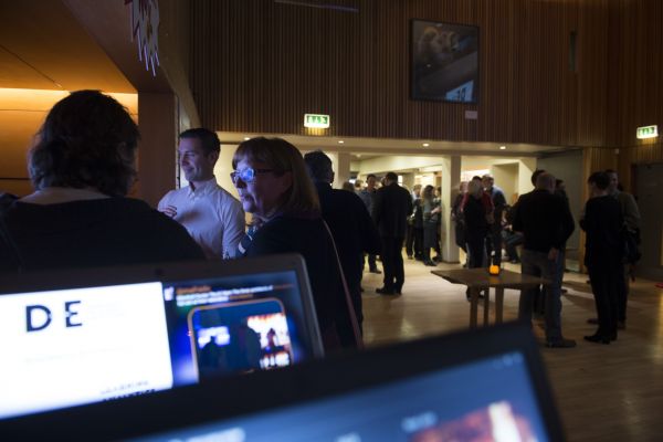 photo of screens and people